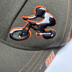 Green and orange Zephyr OTE Cycles cap