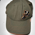 Green and orange Zephyr OTE Cycles cap